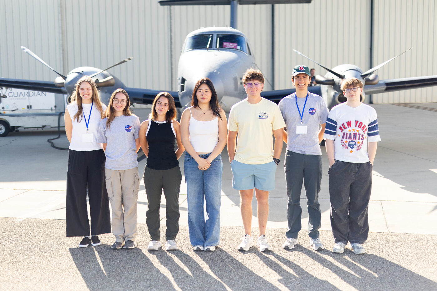 Camille Pawlak's NASA SARP West Oceans Group cohort in front of a research aircraft
